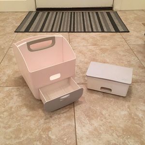 Ubbi diaper caddy with wipe container.